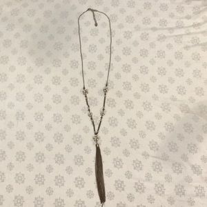 Gold necklace with white bead flowers